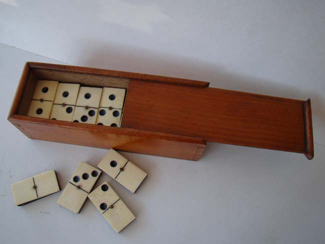 A fine and complete boxed set of Civil War era bone and ebony dominoes circa 1860-1870